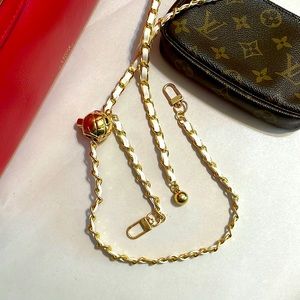 Gold tone white leather bag strap chain